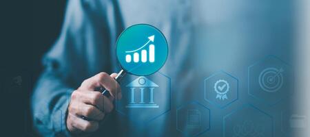 Businessman showing business growth and success graph ,concept of progress in development , financial efficiency and investment ,business strategy for goals ,increase in business profits photo