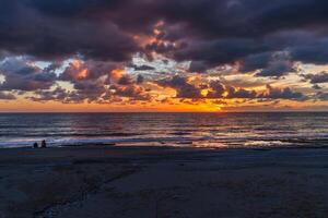 Colorful sunset over ocean photo