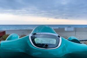 Parked scooter at the beach in winter in Alanya, Turkey photo