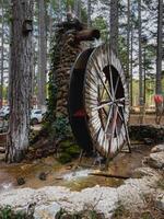Watermill in a forest photo