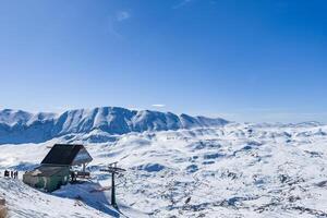 Cabin on a snow mountain photo