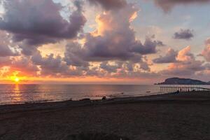 Stunning sunset at the beach photo