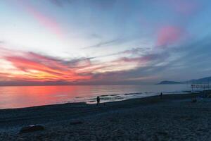 Spectacular sunset at beach photo