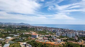 Aerial shot of Alanya city showing the city and sea photo