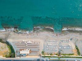 High aerial shot of sandy beach and sea photo