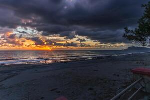 Golden sunset over ocean photo