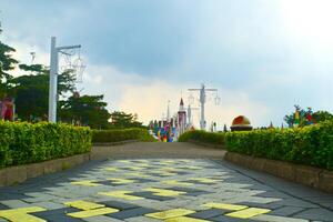 a yellow and black striped sidewalk photo