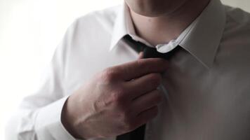 Businessman Adjust Necktie his Suit. Young Business Man Fixing his Tie. Close-up fragment of a man in a business suit correcting his tie video