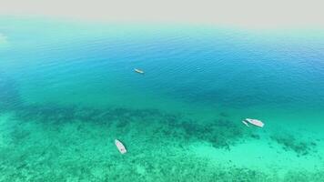 Sea Aerial view, Top view,amazing nature background.The color of the water and beautifully bright.Azure beach with rocky mountains and clear water of Thailand ocean at sunny day. Tropical beach video