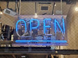 Open Sign in front of a Boutique Shop. photo