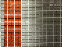 Red and White Glass Tiles Wall Background with Shadow and Light Beam. photo