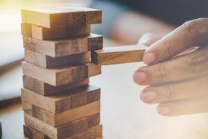 Business risks in the business. Requires planning Meditation must be careful in deciding to reduce the risk in the business. As the game drew to a wooden block from the tower photo