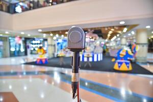 Microphone on abstract blurred of The space in the meeting and stage performances photo