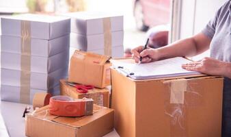 The officer is checking the goods in the warehouse. photo