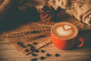 Red coffee glass rests on wood floor. concept still life photo