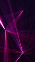 Vertical video - high speed laser light show on black background with flashing neon colored laser beams. This music stage performance background animation is full HD and a seamless loop.