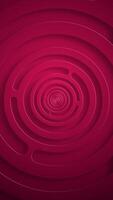 Vertical video - stylish red abstract background with gently rotating concentric circles. This simple geometric technology background animation is full HD and a seamless loop.