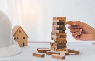 Business risks in the business. Requires planning Meditation must be careful in deciding to reduce the risk in the business. As the game drew to a wooden block from the tower photo