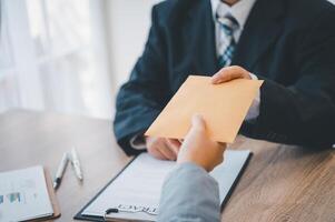 businessman was negotiating a bribery arrangement in which the dollar would be accepted as a bribe. Concepts of anti-bribery and anti-corruption photo