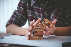 Business risks in the business. Requires planning Meditation must be careful in deciding to reduce the risk in the business. As the game drew to a wooden block from the tower photo