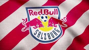 USA - NEW YORK, 12 August 2018. Waving flag with FC Red Bull Salzburg football club logo. Football Club Red Bull Salzburg flag is waving. Editorial footage. video