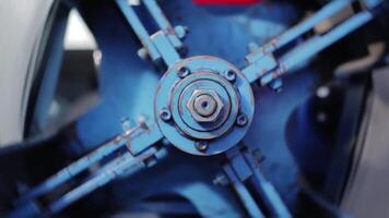 Big bolt. The rotating part of the machine. View of rotation machine in Printing house. Part of machine that is called the star, it changes rolls of paper continuously. manufacturing equipment video