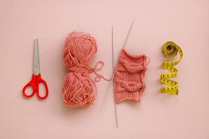 knitting accessories, scissors, skein of thread, knitting, centimeter laid out in a row photo