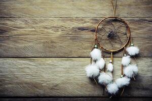 Dream catcher on wooden floor photo