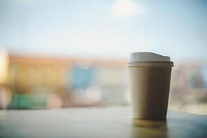 Coffee cup paper, background sky and city photo