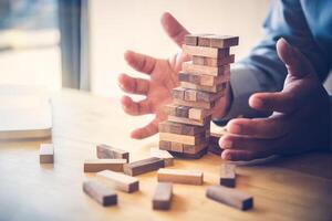 Business risks in the business. Requires planning Meditation must be careful in deciding to reduce the risk in the business. As the game drew to a wooden block from the tower photo