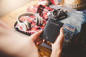 People holding passports, map for travel with luggage for the trip photo