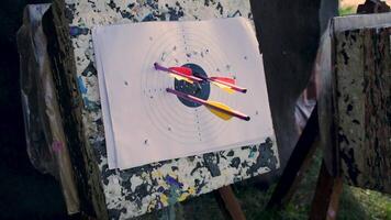 Arrow in the wooden target. Clip. Archery target. Series of straw archery targets in wooden stands. An outdoor target for shooting with a bow and arrows on a summer day on the streets video