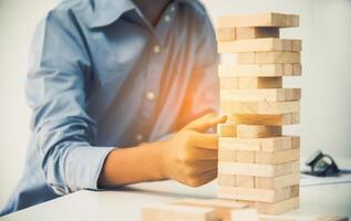 Business risks in the business. Requires planning Meditation must be careful in deciding to reduce the risk in the business. As the game drew to a wooden block from the tower photo