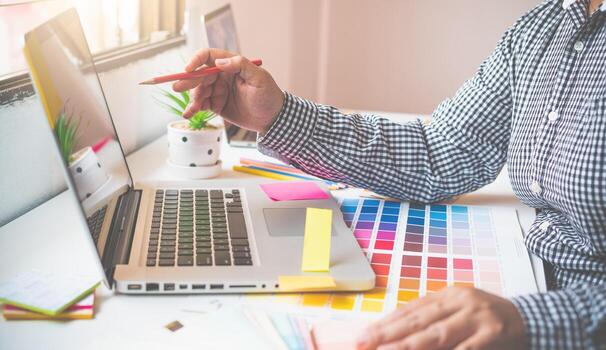 The graphic designer creative team is currently working on the design and color selection on the guide color for advertising design. photo
