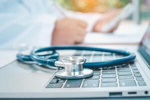 Stethoscope with clipboard on desk,Doctor Recommends Patient, Healthcare and medical concept. photo