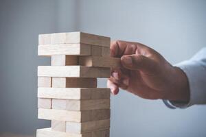 Business risks in the business. Requires planning Meditation must be careful in deciding to reduce the risk in the business. As the game drew to a wooden block from the tower photo