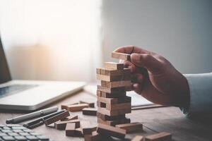 Business risks in the business. Requires planning Meditation must be careful in deciding to reduce the risk in the business. As the game drew to a wooden block from the tower photo