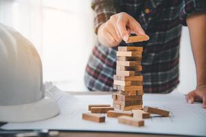 Business risks in the business. Requires planning Meditation must be careful in deciding to reduce the risk in the business. As the game drew to a wooden block from the tower photo