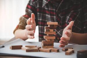 Business risks in the business. Requires planning Meditation must be careful in deciding to reduce the risk in the business. As the game drew to a wooden block from the tower photo