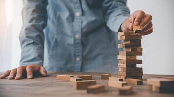 Business risks in the business. Requires planning Meditation must be careful in deciding to reduce the risk in the business. As the game drew to a wooden block from the tower photo