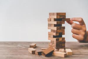 Business risks in the business. Requires planning Meditation must be careful in deciding to reduce the risk in the business. As the game drew to a wooden block from the tower photo