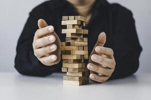 Business risks in the business. Requires planning Meditation must be careful in deciding to reduce the risk in the business. As the game drew to a wooden block from the tower photo