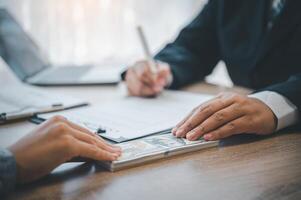 businessman was negotiating a bribery arrangement in which the dollar would be accepted as a bribe. Concepts of anti-bribery and anti-corruption photo
