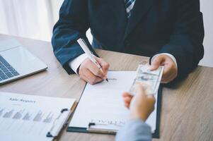 businessman was negotiating a bribery arrangement in which the dollar would be accepted as a bribe. Concepts of anti-bribery and anti-corruption photo