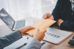 businessman was negotiating a bribery arrangement in which the dollar would be accepted as a bribe. Concepts of anti-bribery and anti-corruption photo