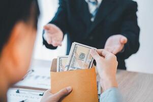 businessman was negotiating a bribery arrangement in which the dollar would be accepted as a bribe. Concepts of anti-bribery and anti-corruption photo