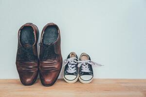 The shoes of father and son. concept father day photo
