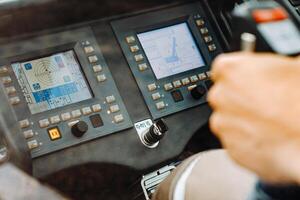 The control panel of the crane in the driver's cabin of the automobile crane photo