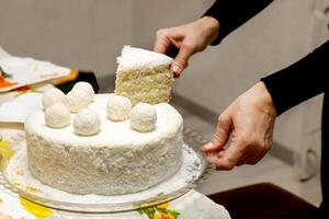 woman treating herself to a piece of homemade cake photo