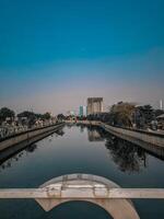 a view of a canal in front of a city photo